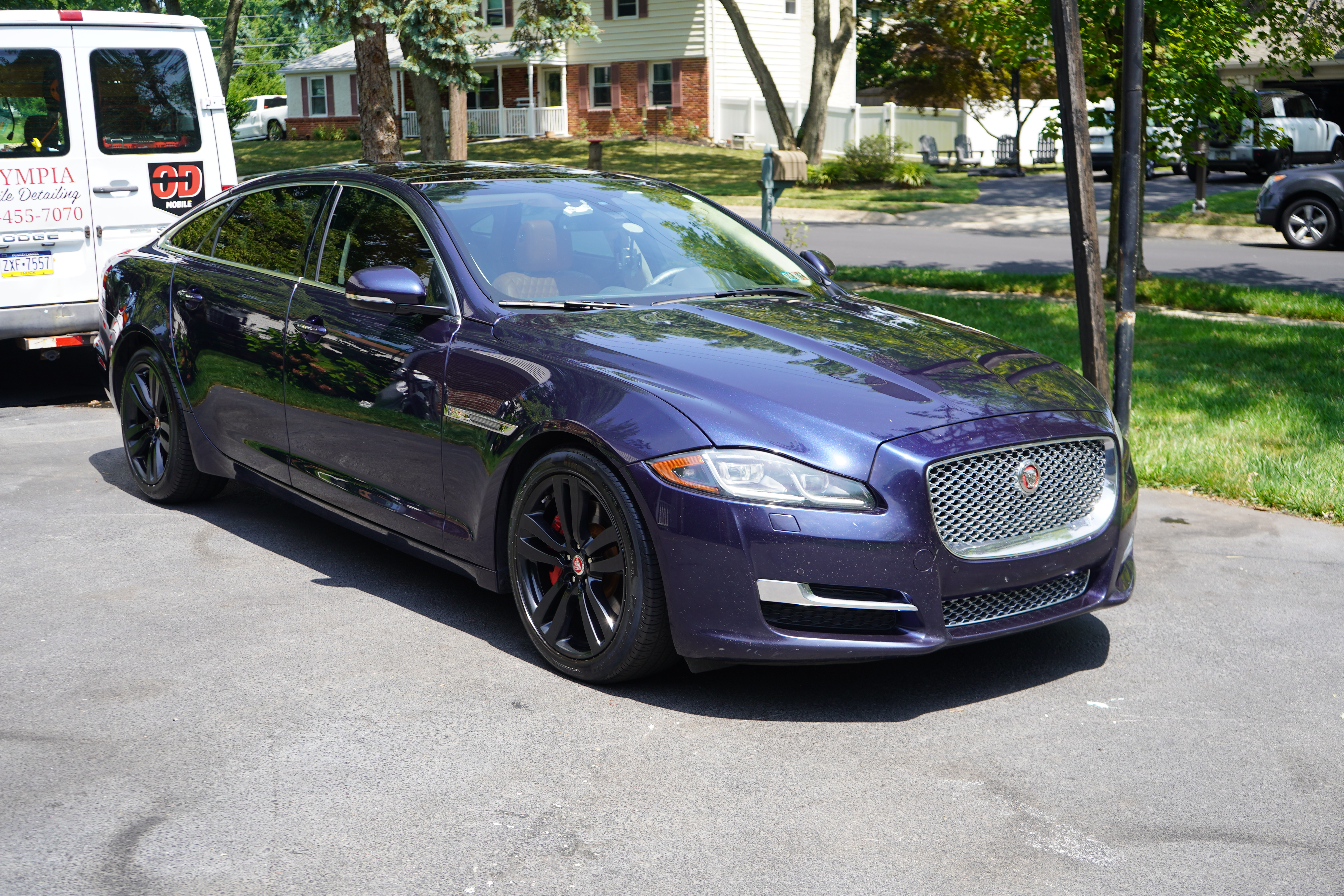 Dark blue Jaguar XJ full side after detail