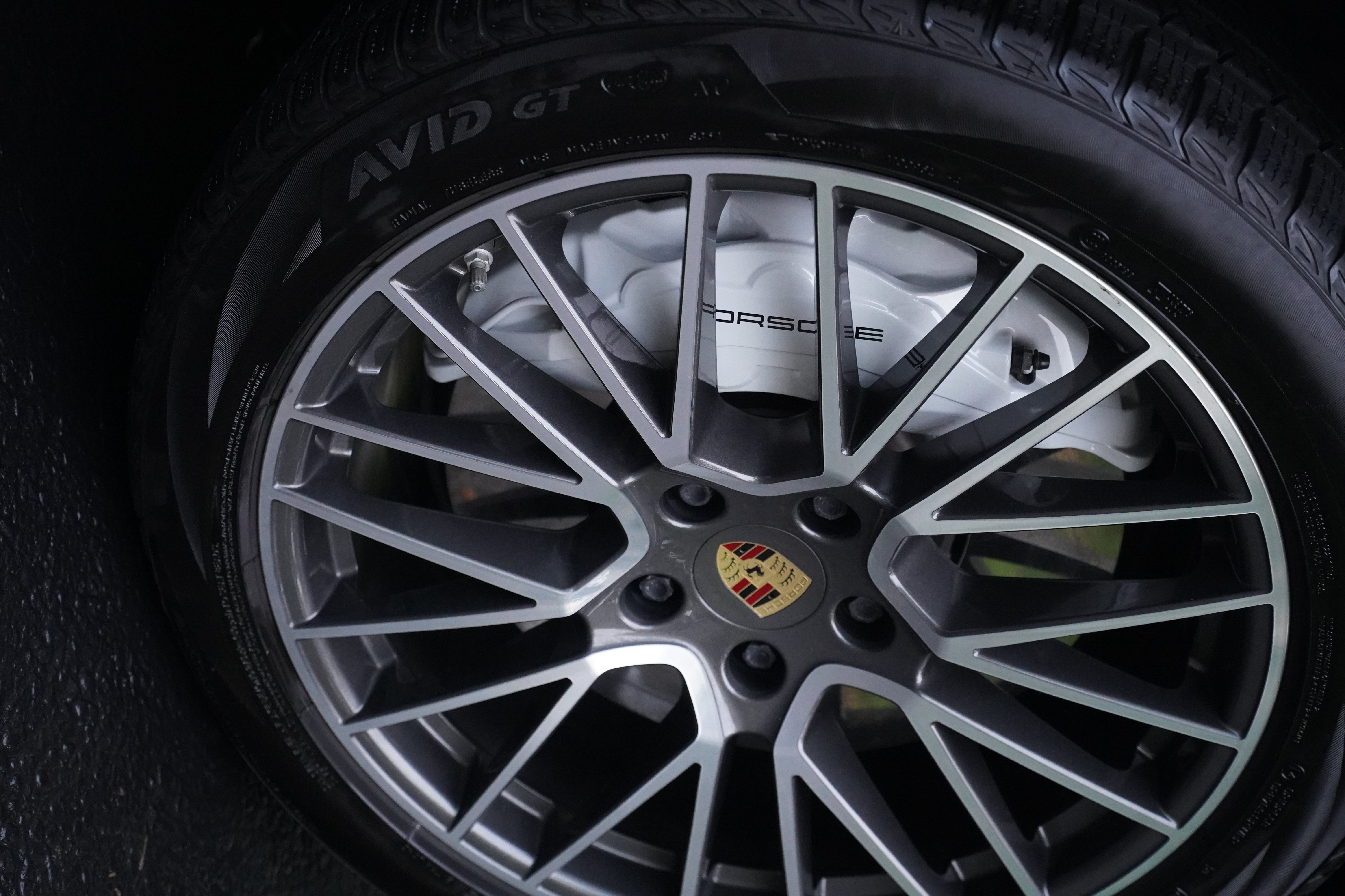 Porsche multi-spoke wheel after detail, grey with yellow caliper