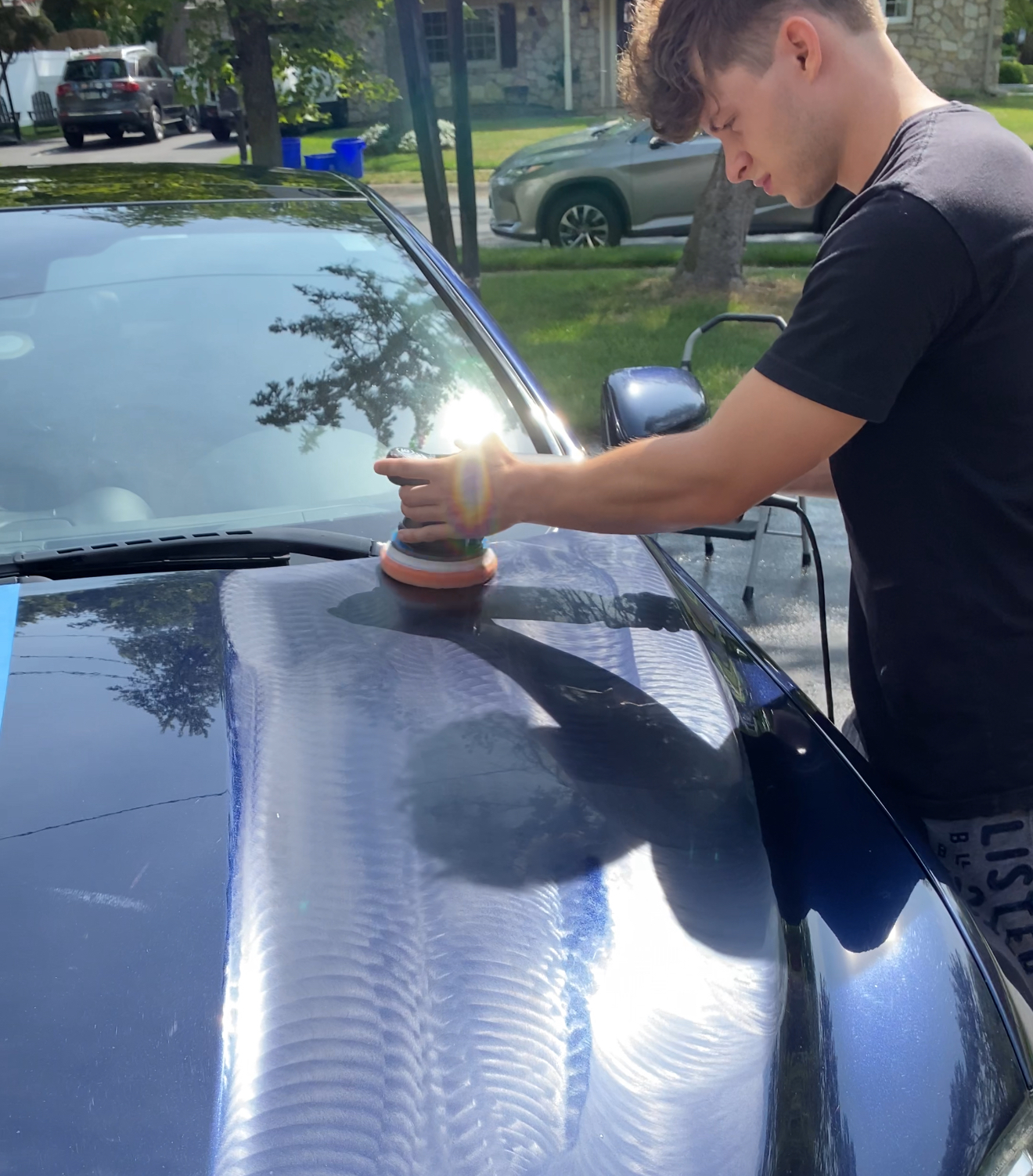 Paint correction in progress - machine polishing Jaguar XJ hood Wayne PA