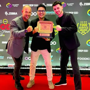 Spring Feeling Meal Kit management team holding the Food Services Award after being voted #1 for Innovation in Menu Design, Display & Presentation in the UAE.