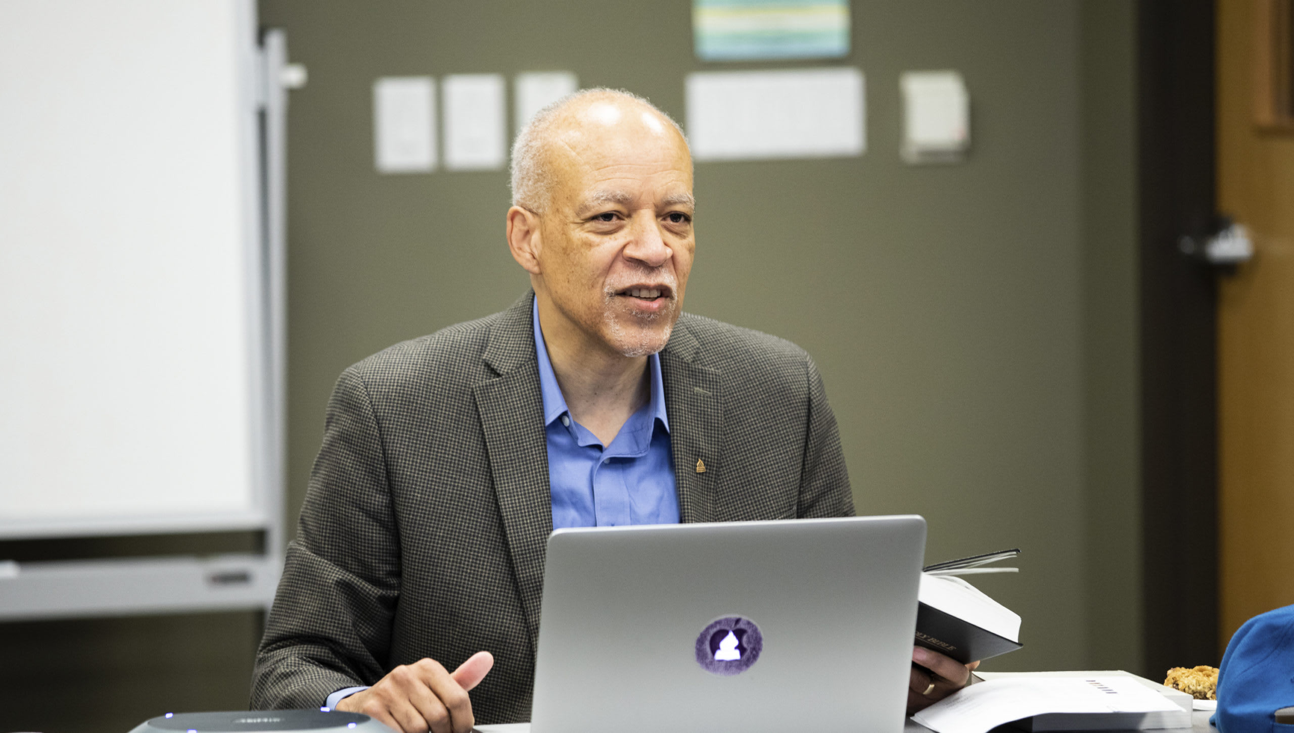Dr. Orr teaching behind a laptop