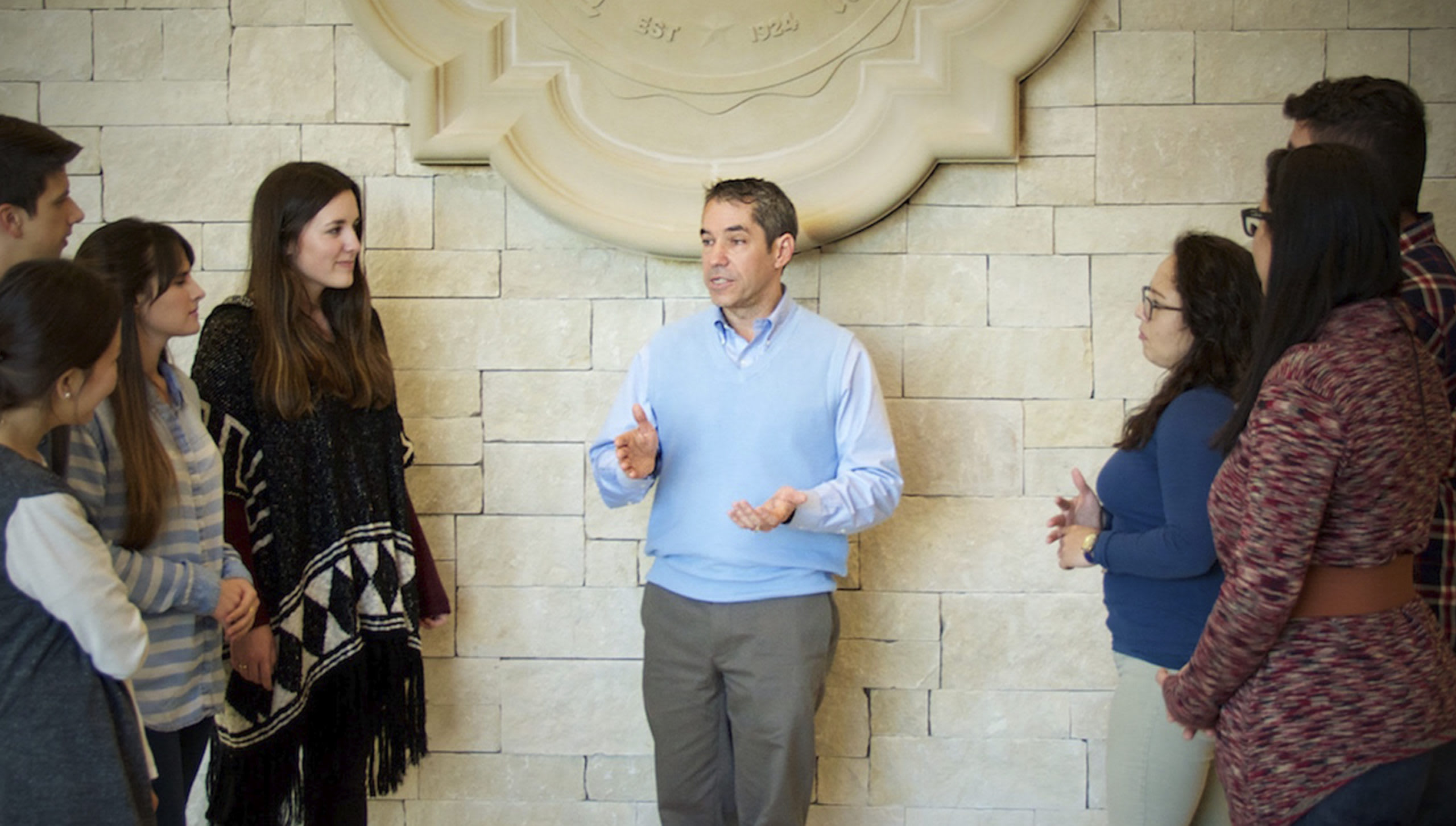 Dr. Ortiz talking with students