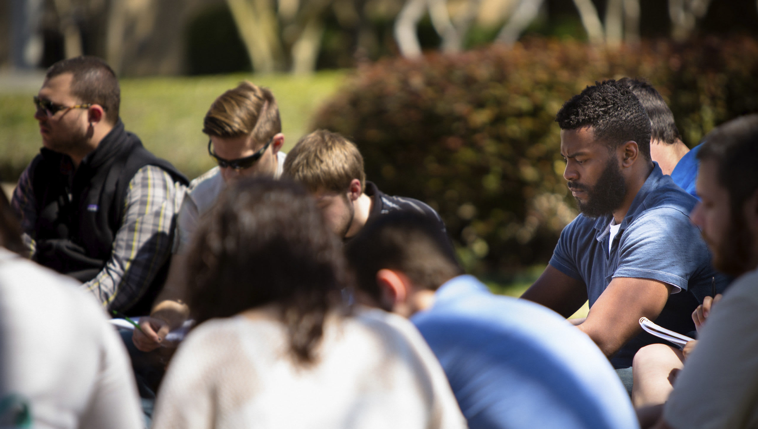 students outside praying