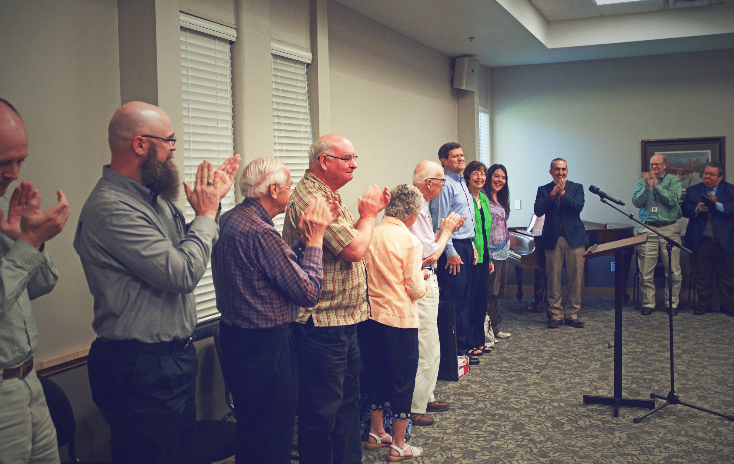 Dr. Buist Fanning receiving applause from DTS professors celebrating his retirement
