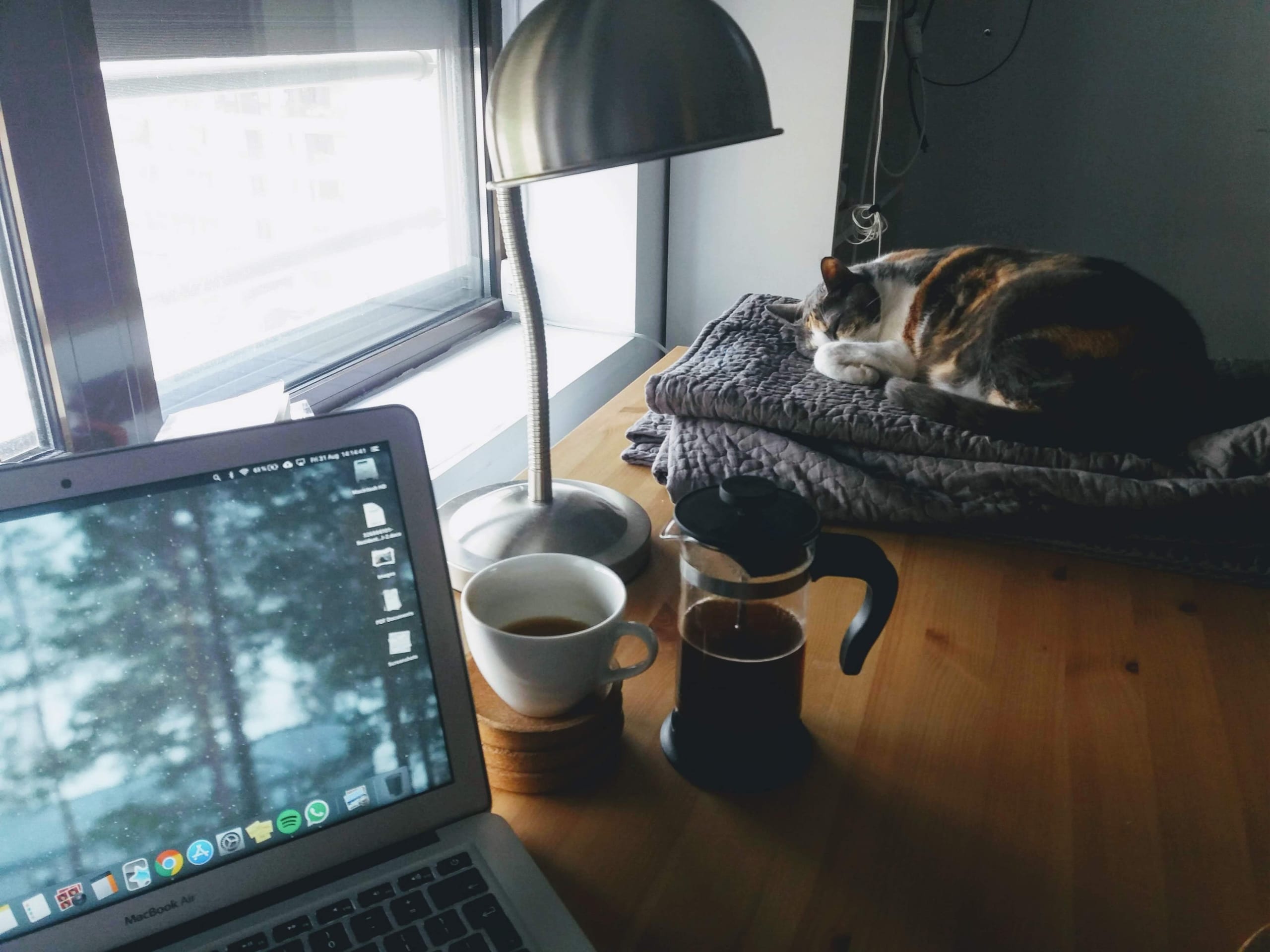 Desk prepared with coffee and computer for online worship