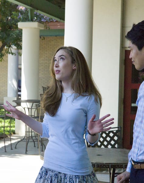 girl talking in front of Michell Hall