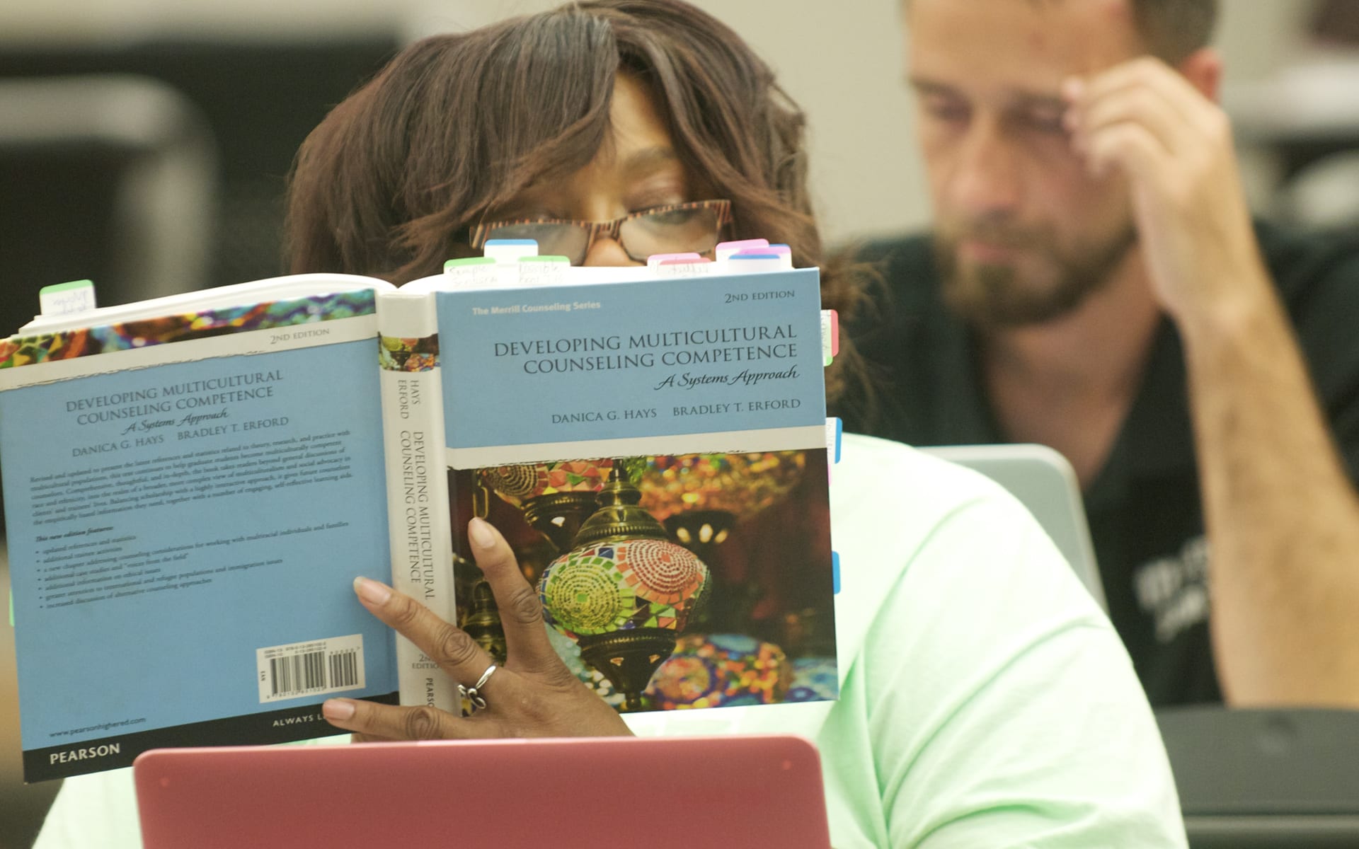 girl reading a textbook
