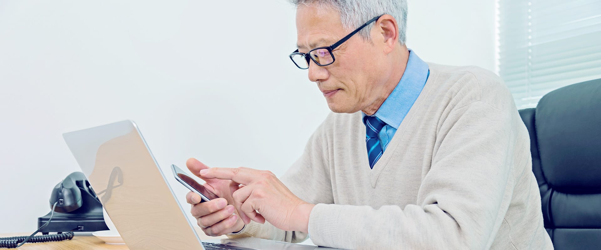 Chinese man working at a computer