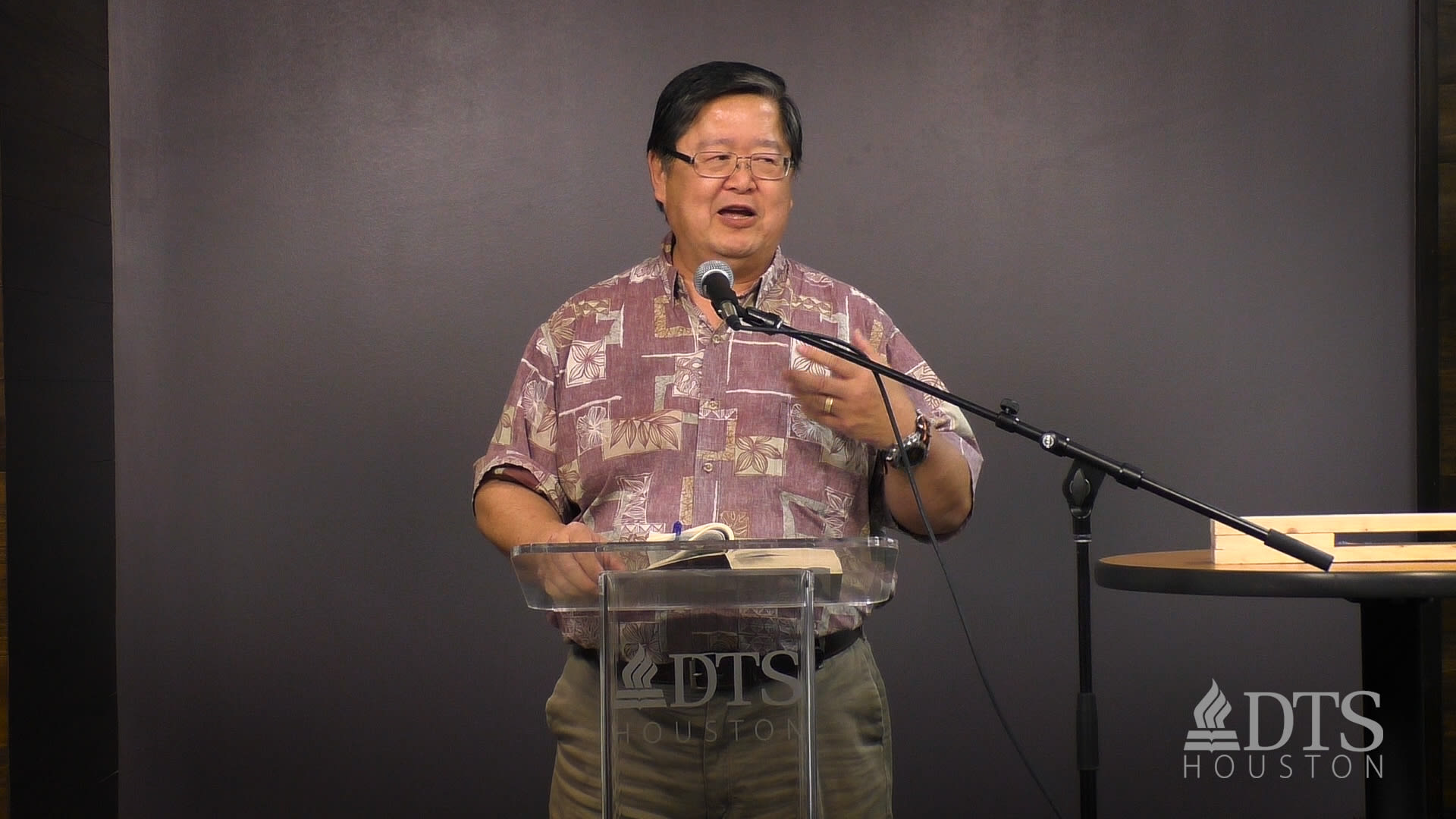 man standing at podium speaking at DTS Chapel