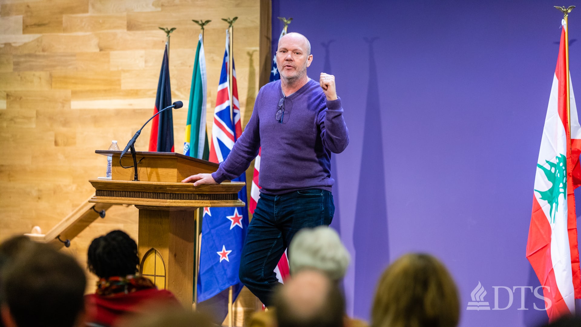 man standing at podium speaking at DTS Chapel