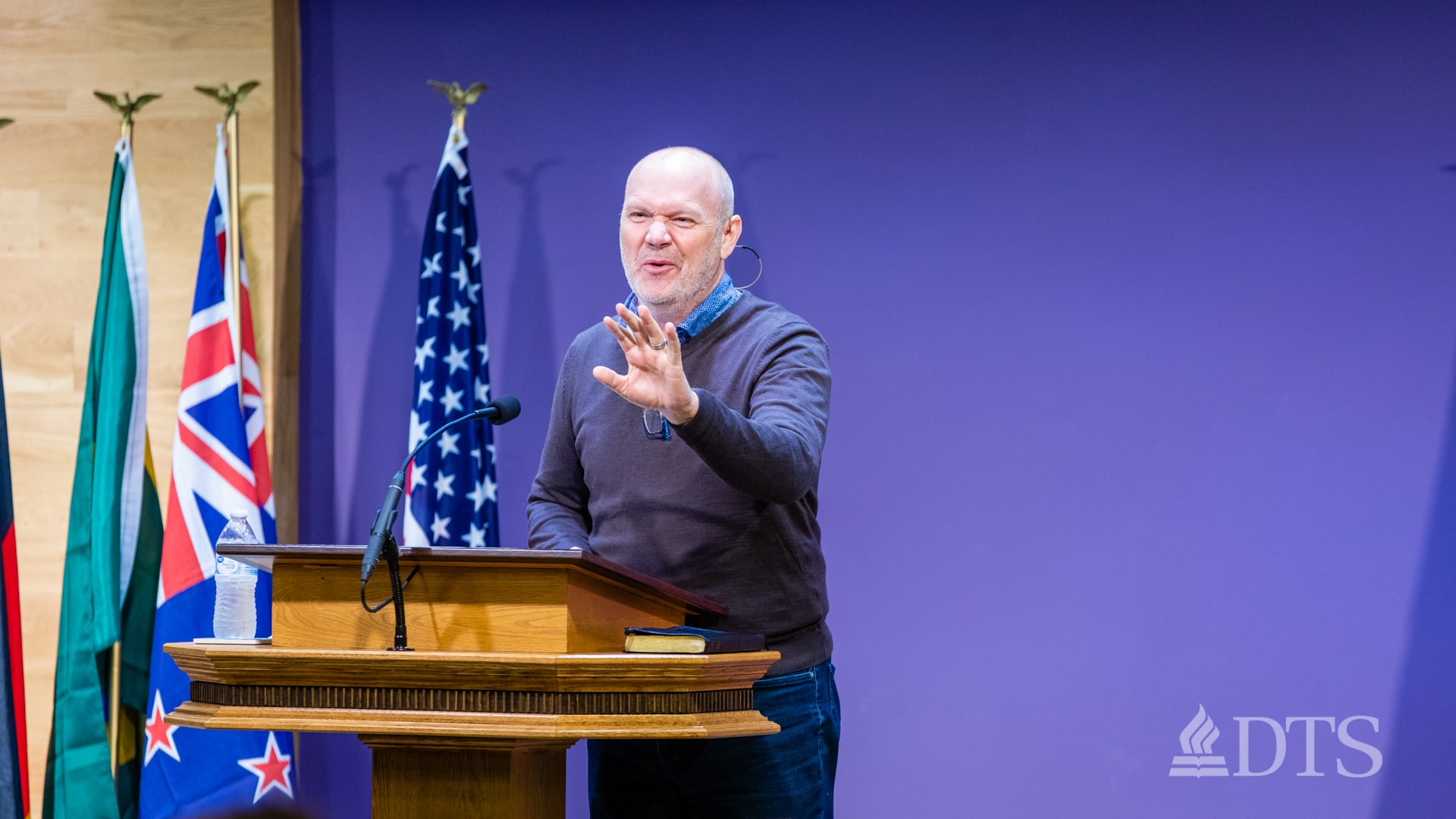 man standing at podium speaking at DTS Chapel