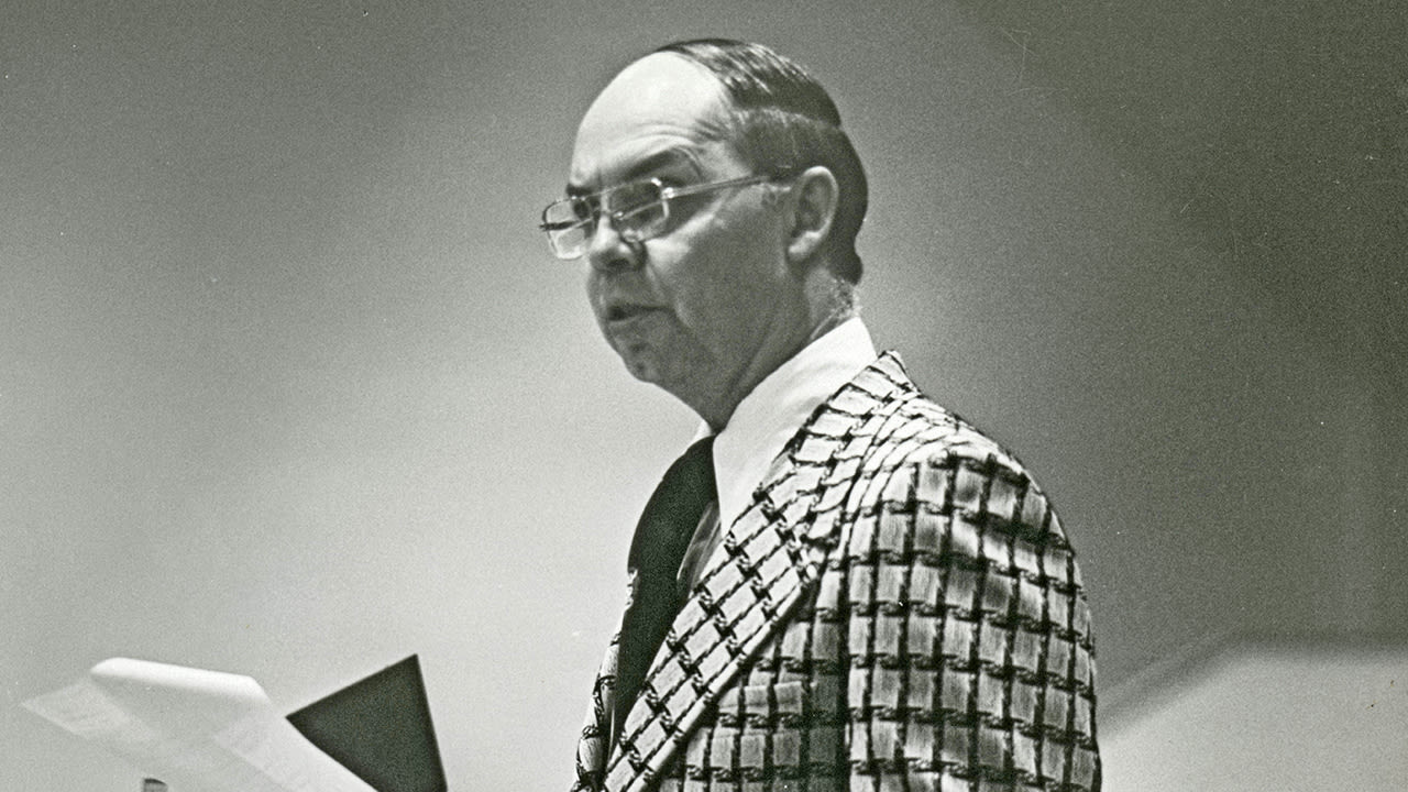 Dr. Lightner looking at an audience while teaching