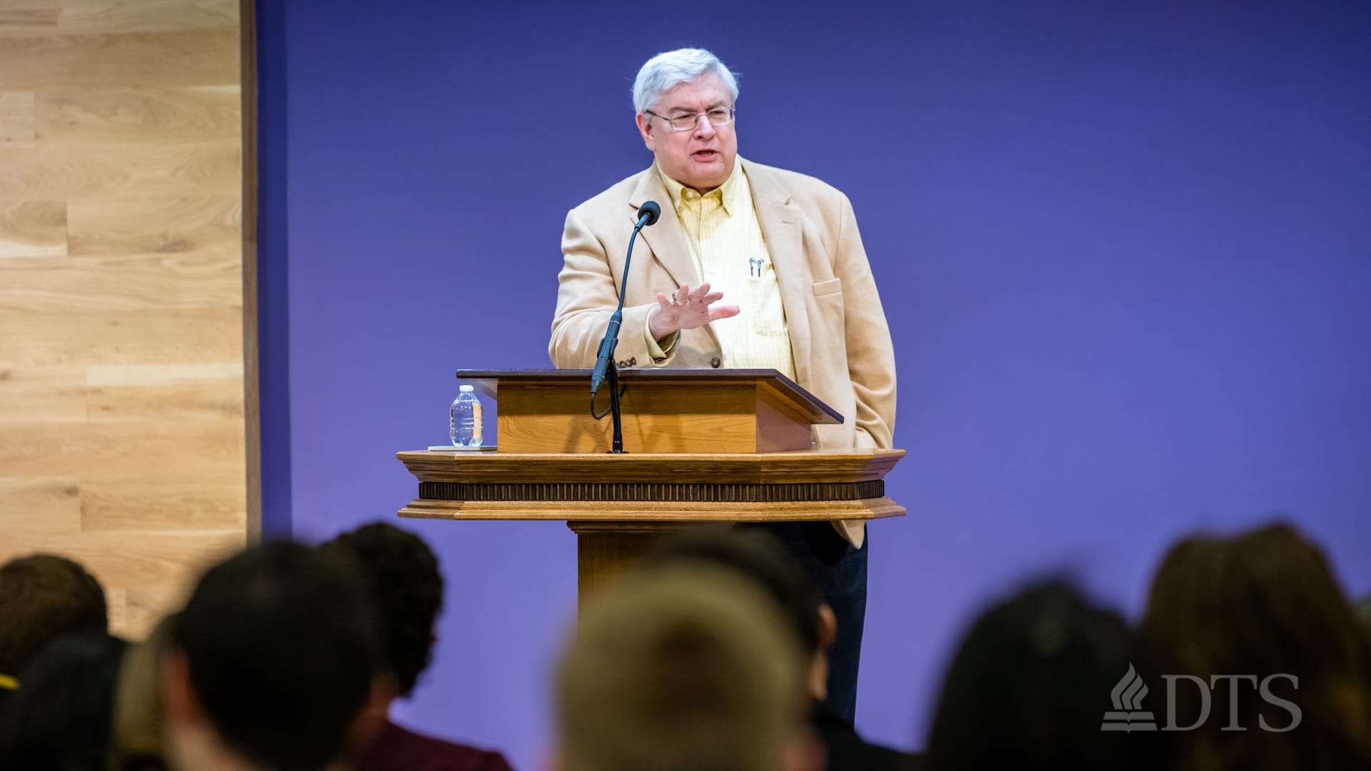 man standing at podium speaking at DTS Chapel