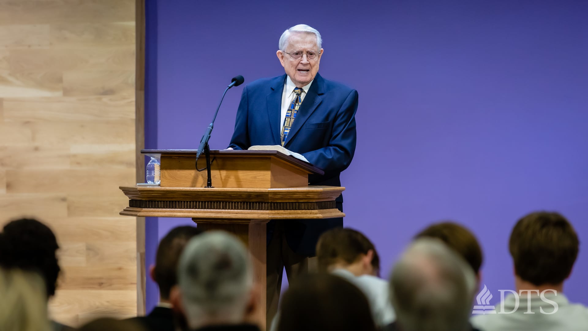 Dr. Swindoll standing at podium speaking at DTS Chapel