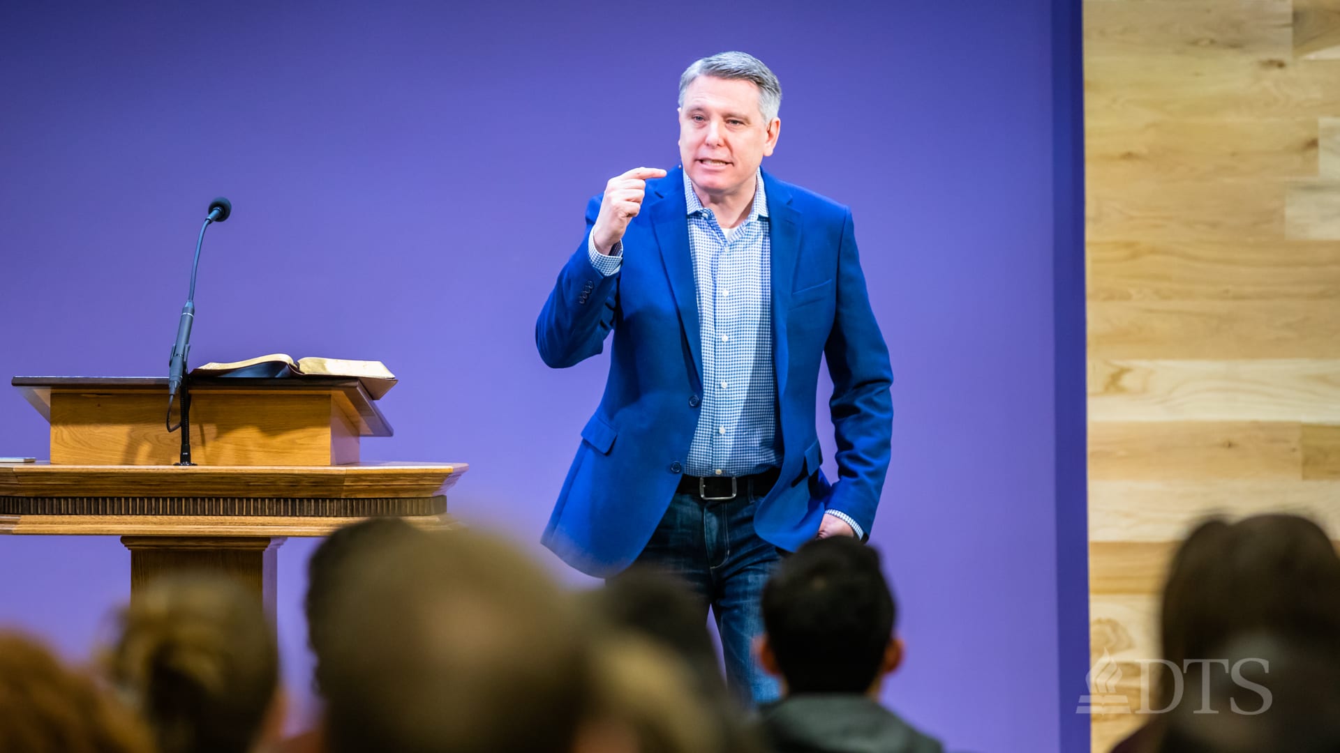 man standing at podium speaking at DTS Chapel