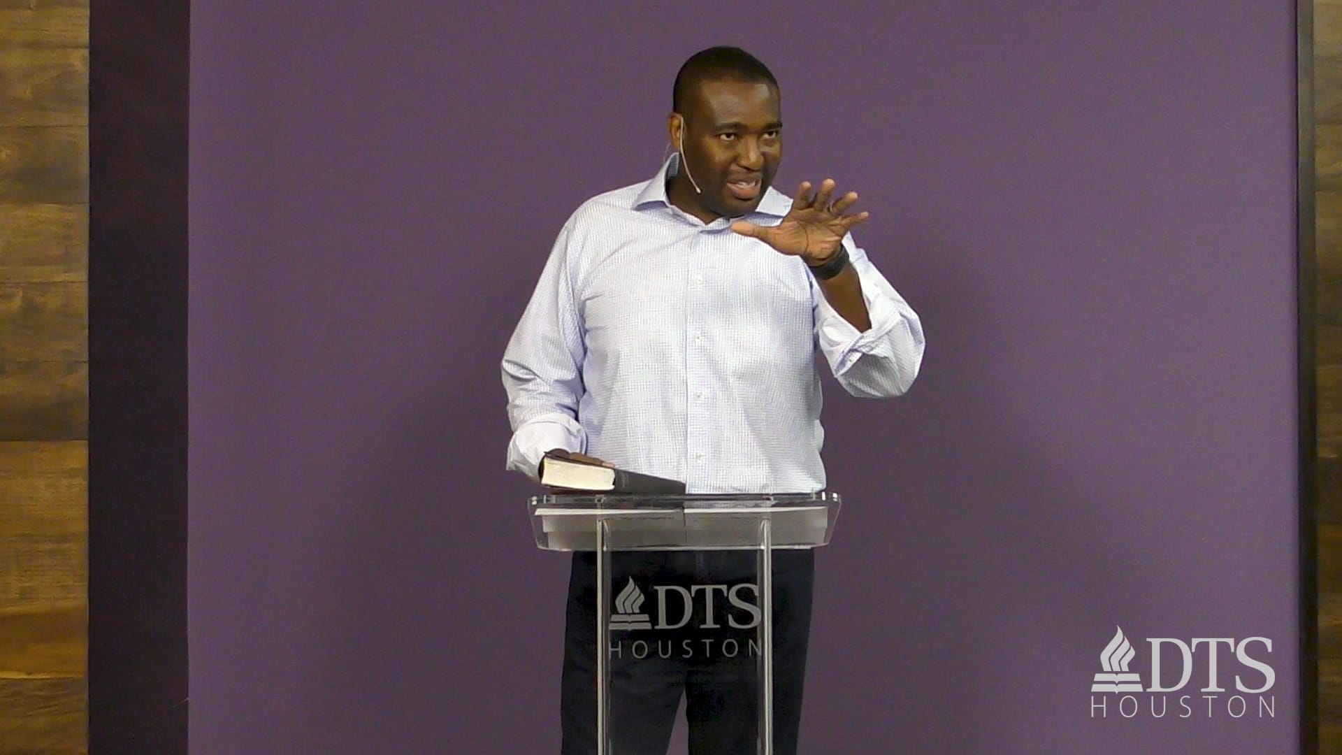 man standing at podium speaking at DTS Chapel