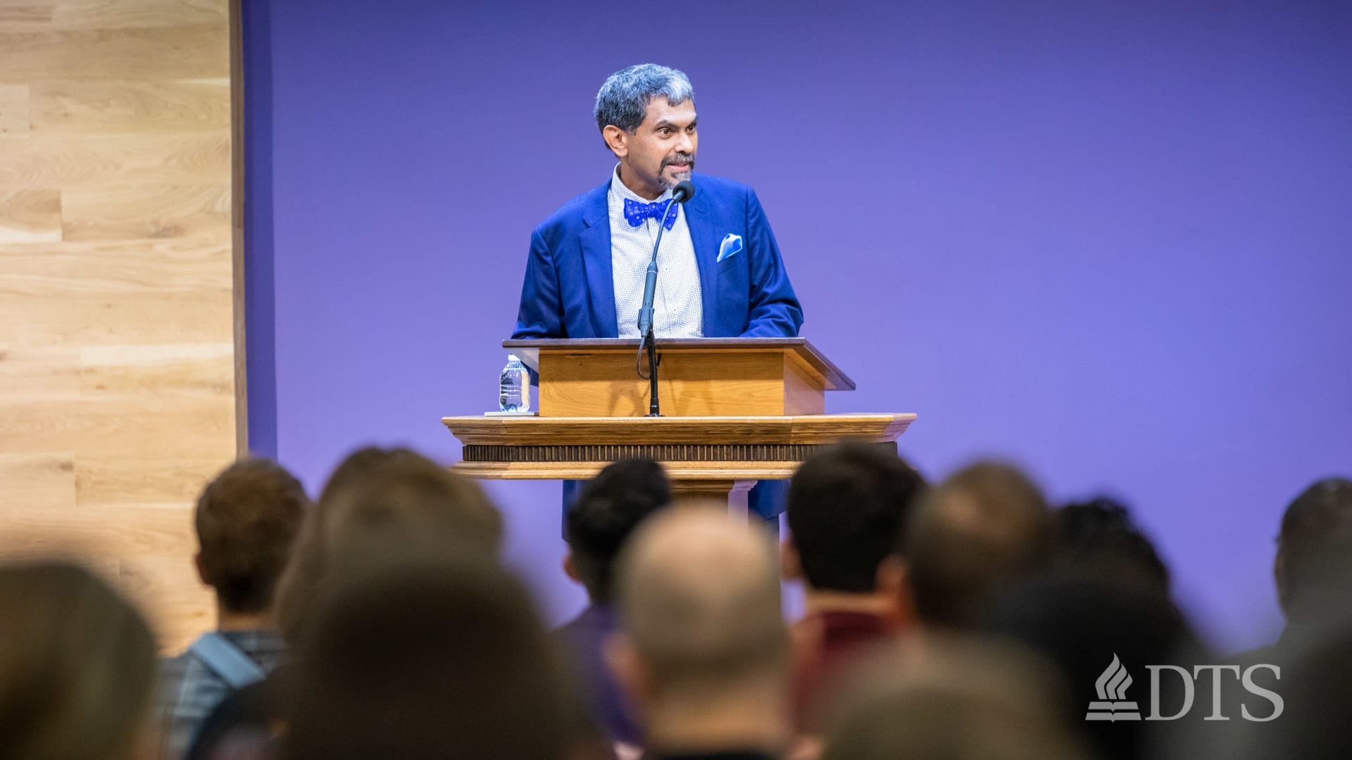 man standing at podium speaking at DTS Chapel