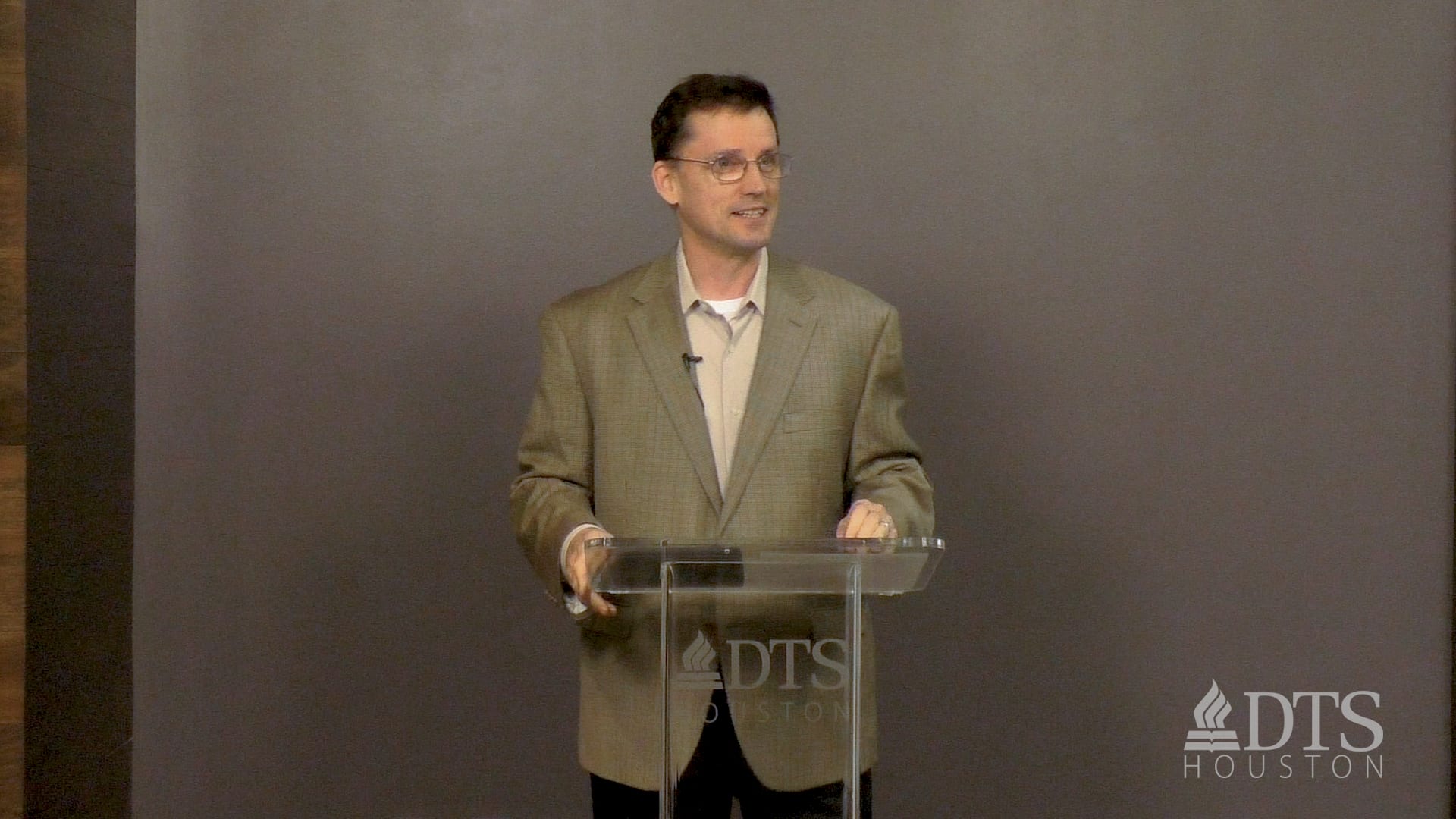 man standing at podium speaking at DTS Chapel
