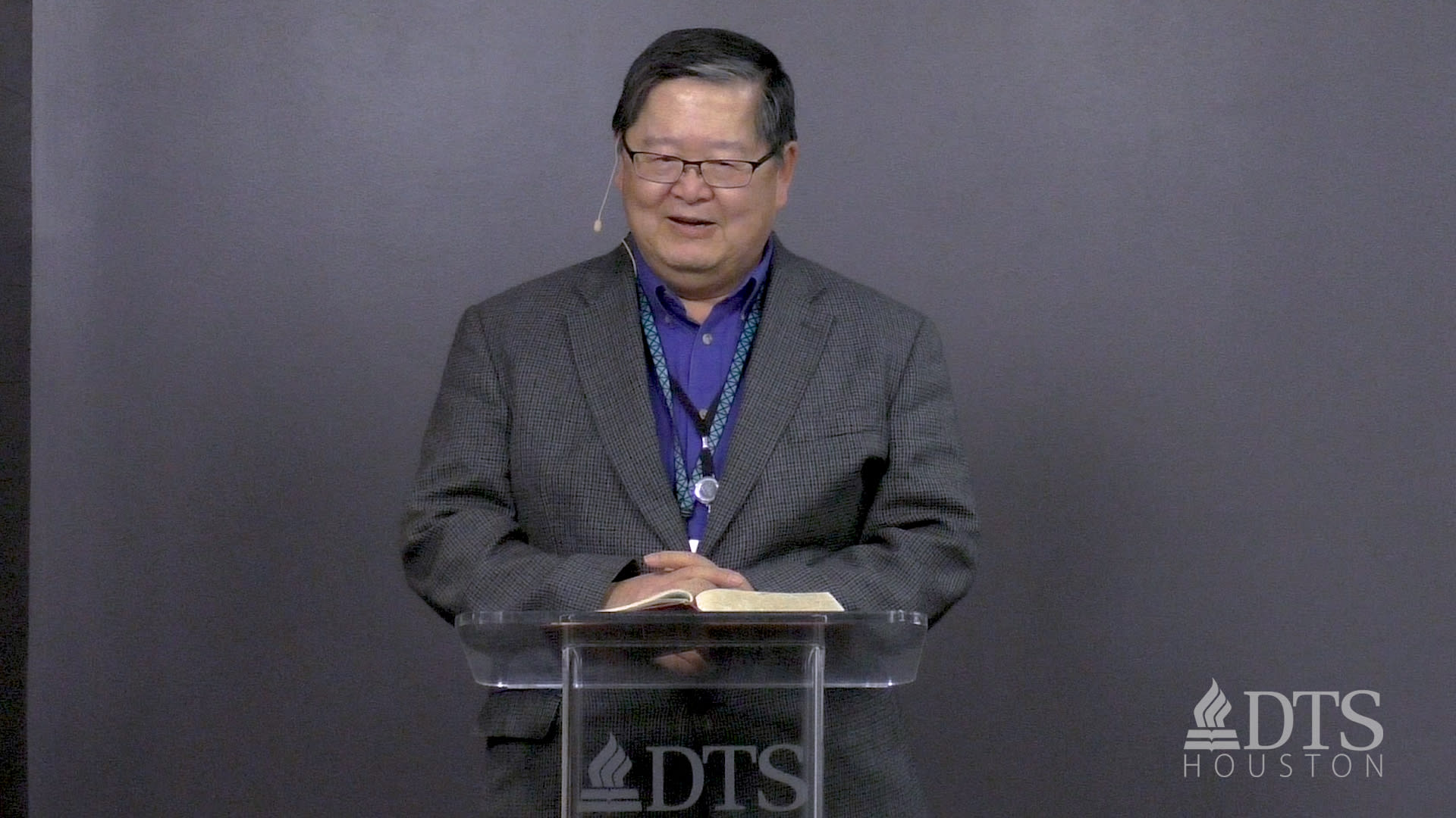 man standing at podium speaking at DTS Chapel