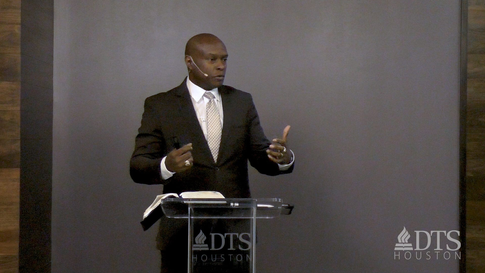 man standing at podium speaking at DTS Chapel