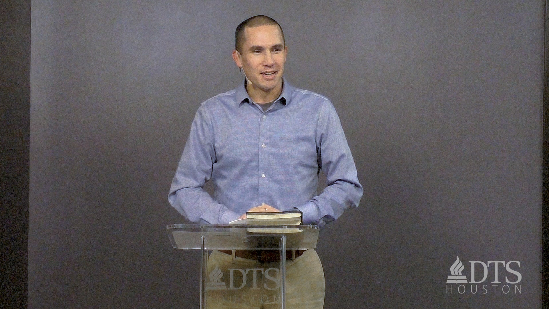 man standing at podium speaking at DTS Chapel