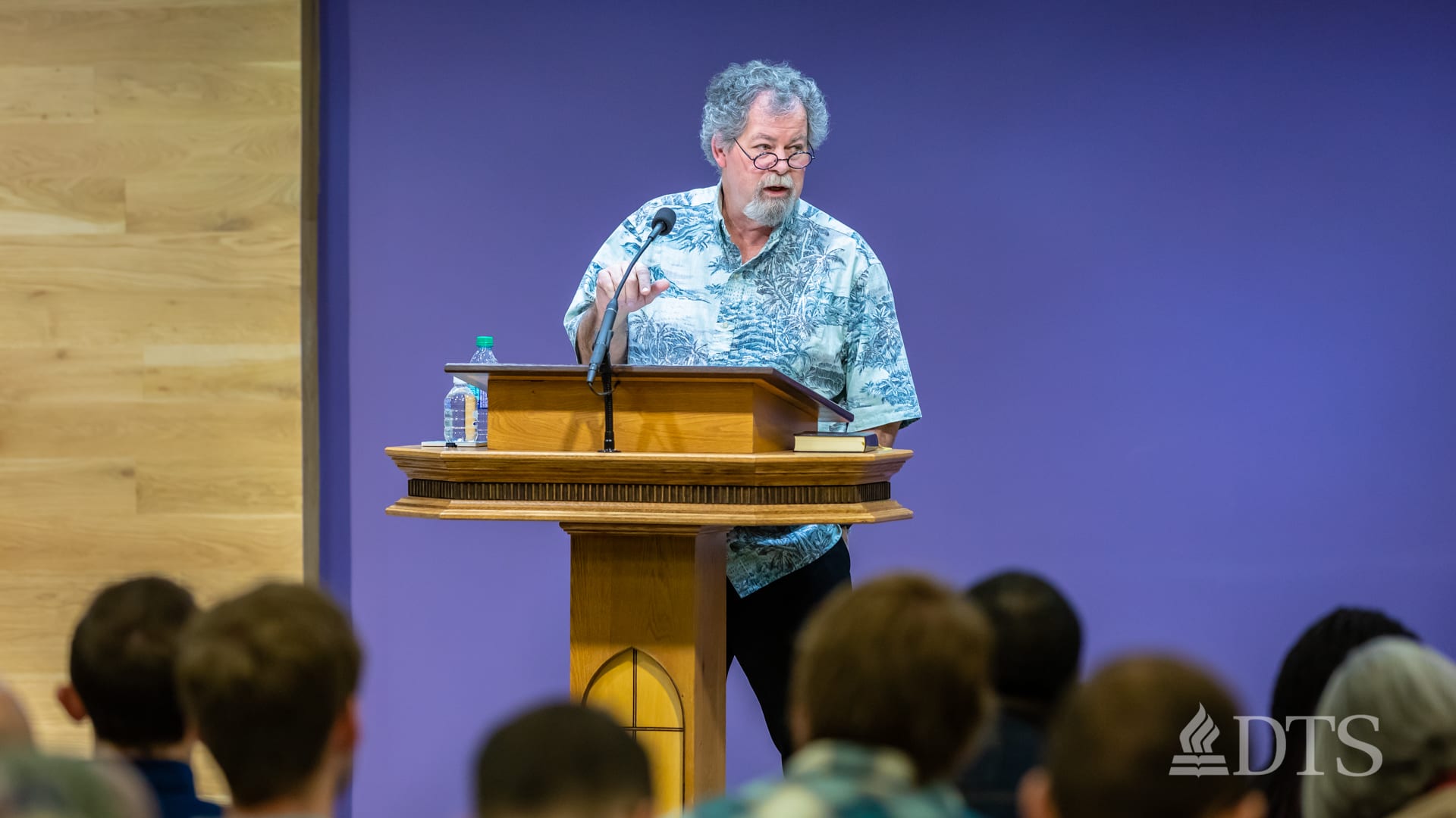 man standing at podium speaking at DTS Chapel