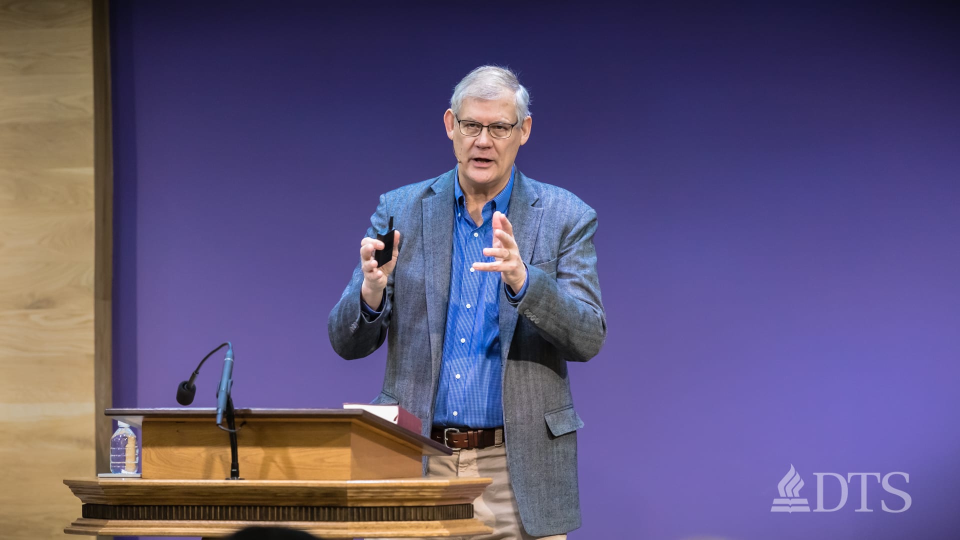 man standing at podium speaking at DTS Chapel