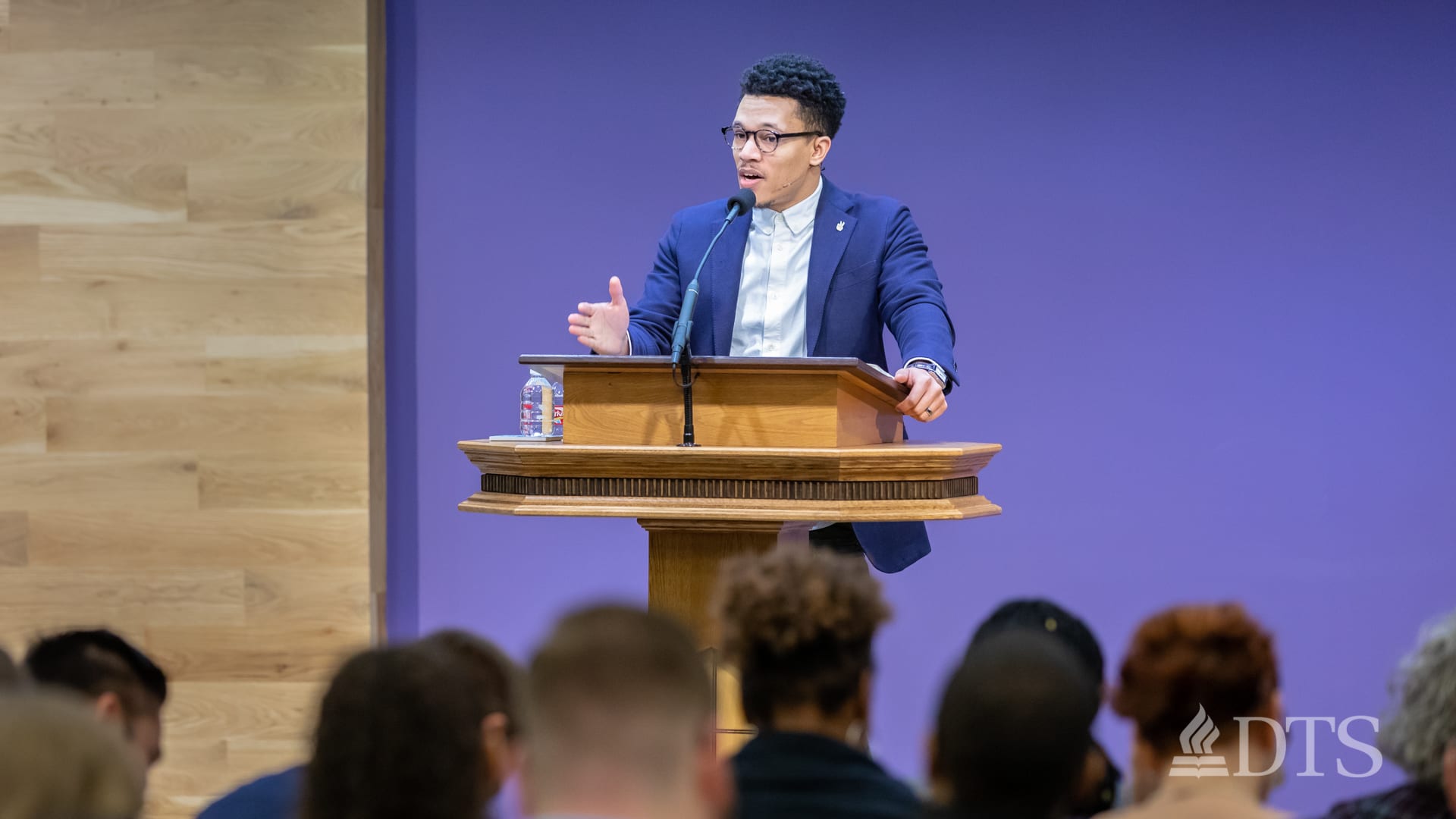 man standing at podium speaking at DTS Chapel
