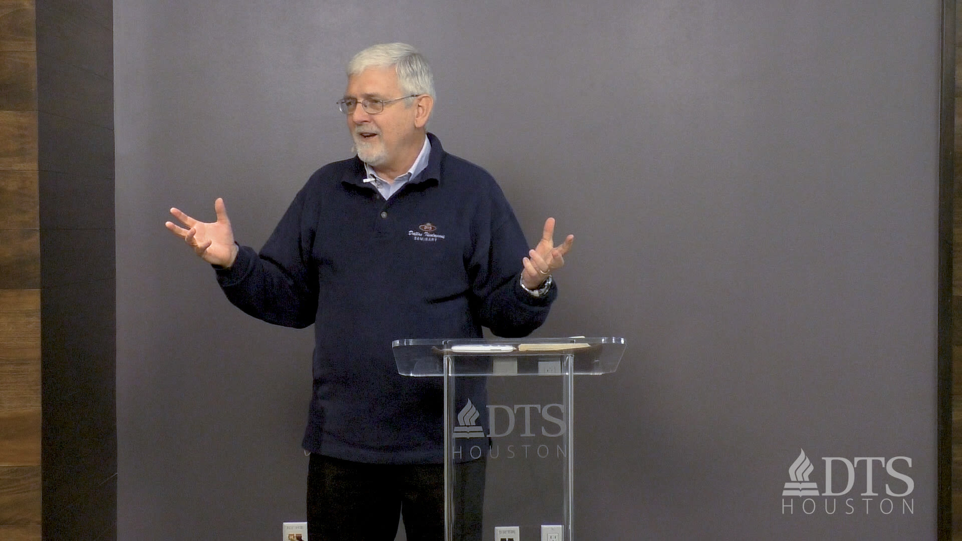 man standing at podium speaking at DTS Chapel