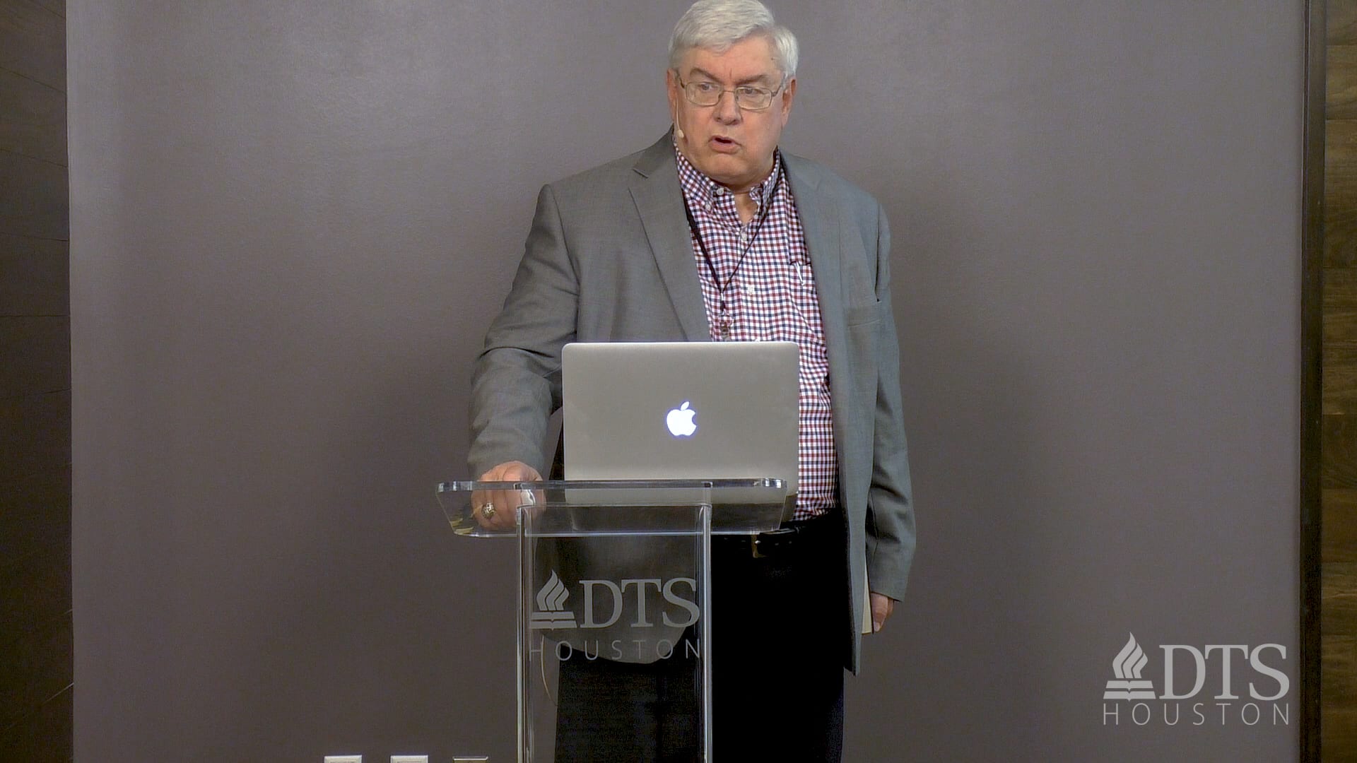 man standing at podium speaking at DTS Chapel