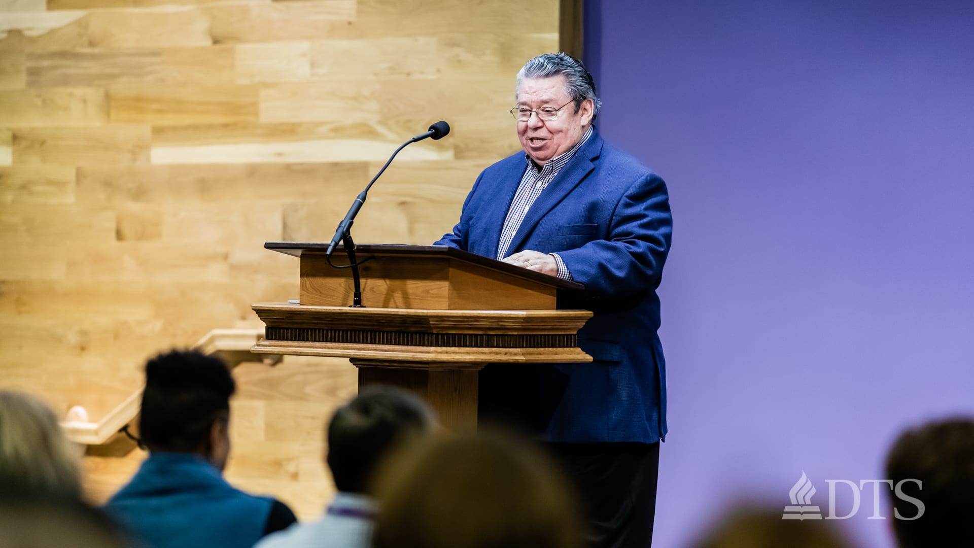 Dr. Mark Bailey standing at podium speaking at DTS Chapel