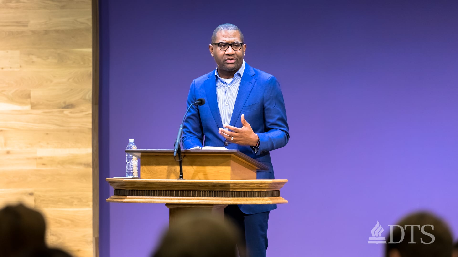 Dr. Bryan Carter standing at podium speaking at DTS Chapel