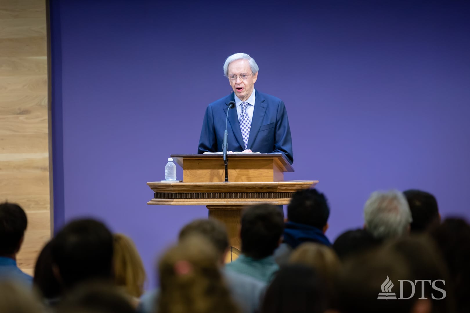 man standing at podium speaking at DTS Chapel