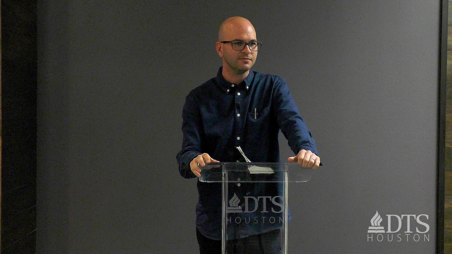 man standing at podium speaking at DTS Chapel