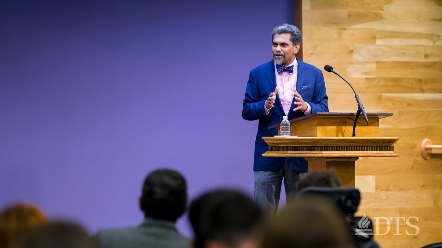 man standing at podium speaking at DTS Chapel