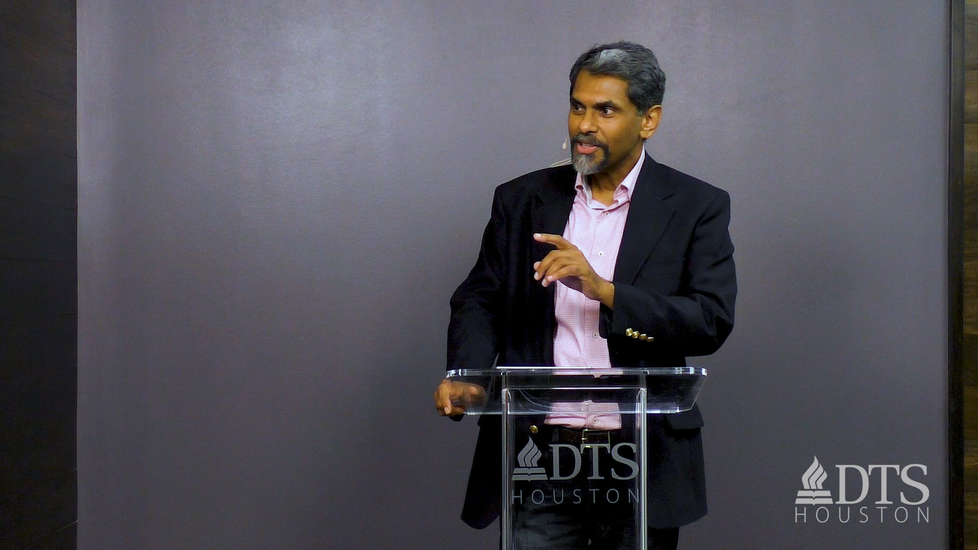 man standing at podium speaking at DTS Chapel