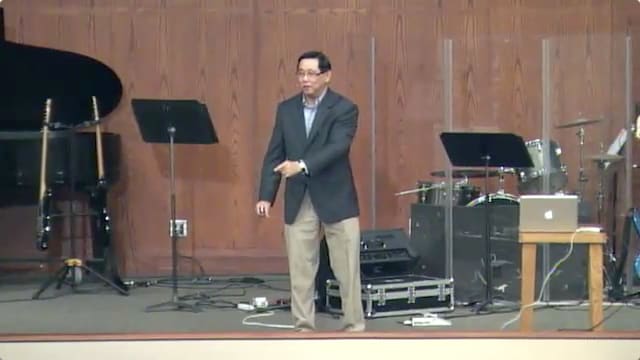 man standing on stage speaking at DTS WEC Week