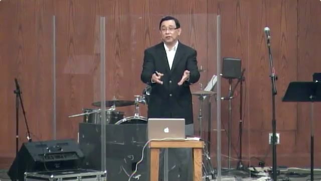 man standing on stage speaking at DTS WEC Week