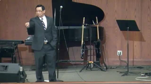 man standing on stage speaking at DTS WEC Week
