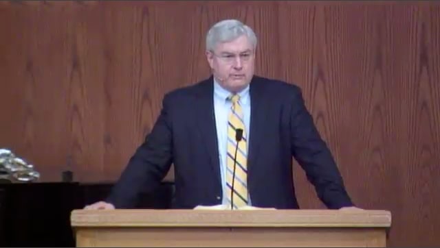 man standing at podium speaking at DTS Chapel