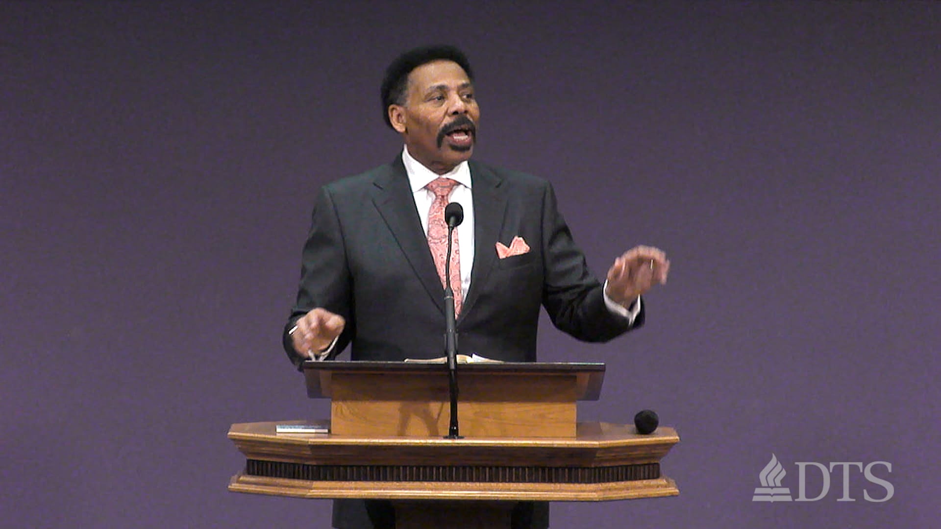 Dr. Tony Evans standing at podium speaking at DTS Chapel