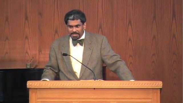 man standing at podium speaking at DTS Chapel