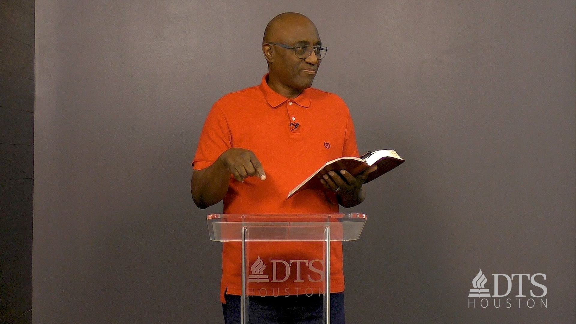 man standing at podium speaking at DTS Chapel