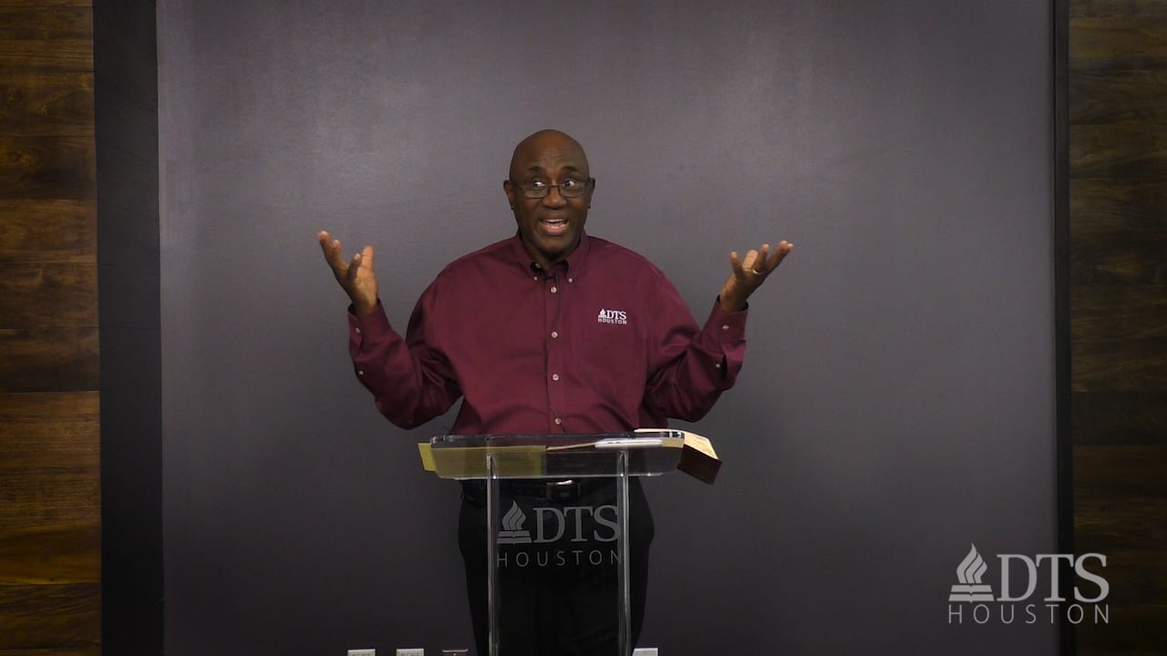 man standing at podium speaking at DTS Chapel
