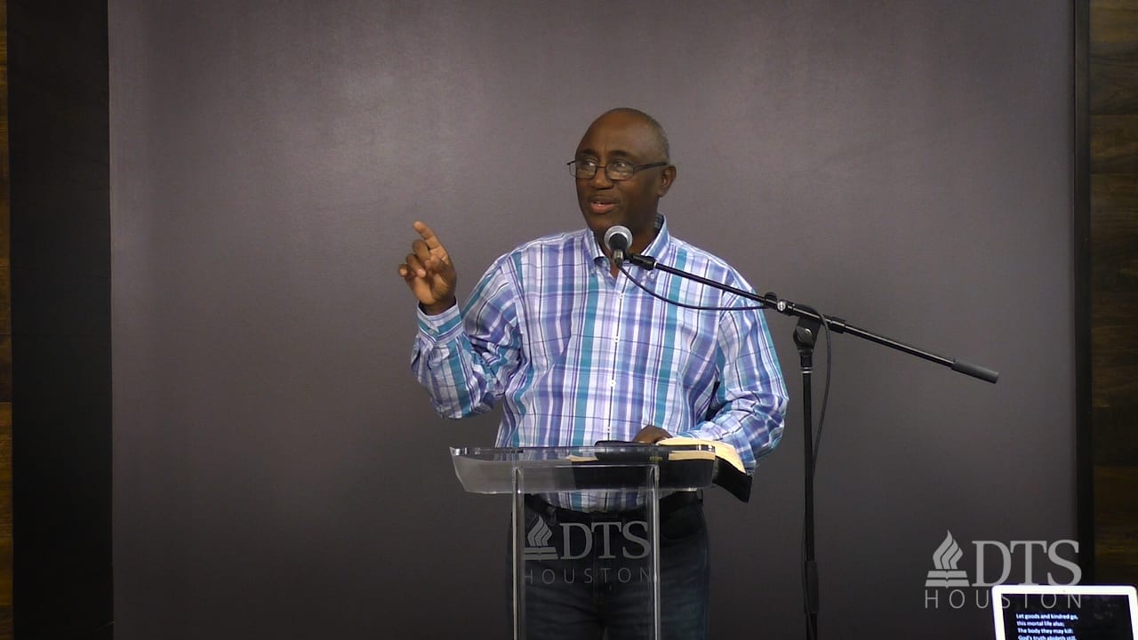 man standing at podium speaking at DTS Chapel