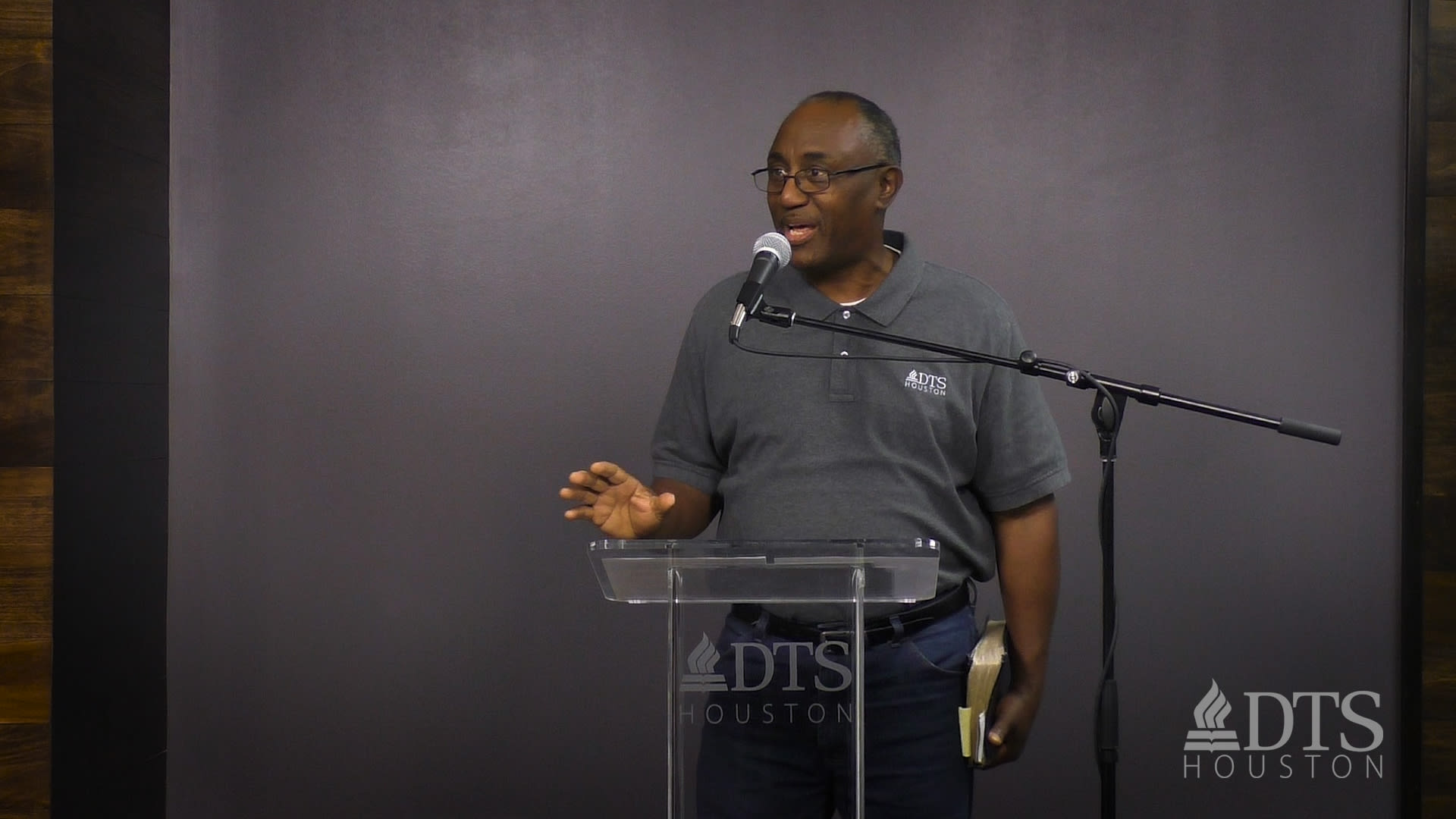 man standing at podium speaking at DTS Chapel