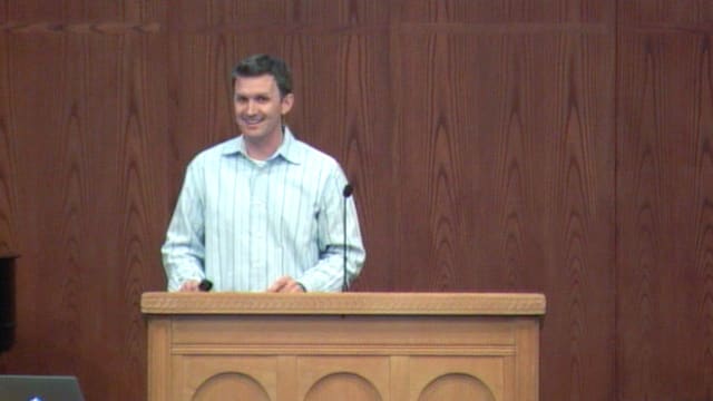 man standing at podium speaking at DTS Chapel