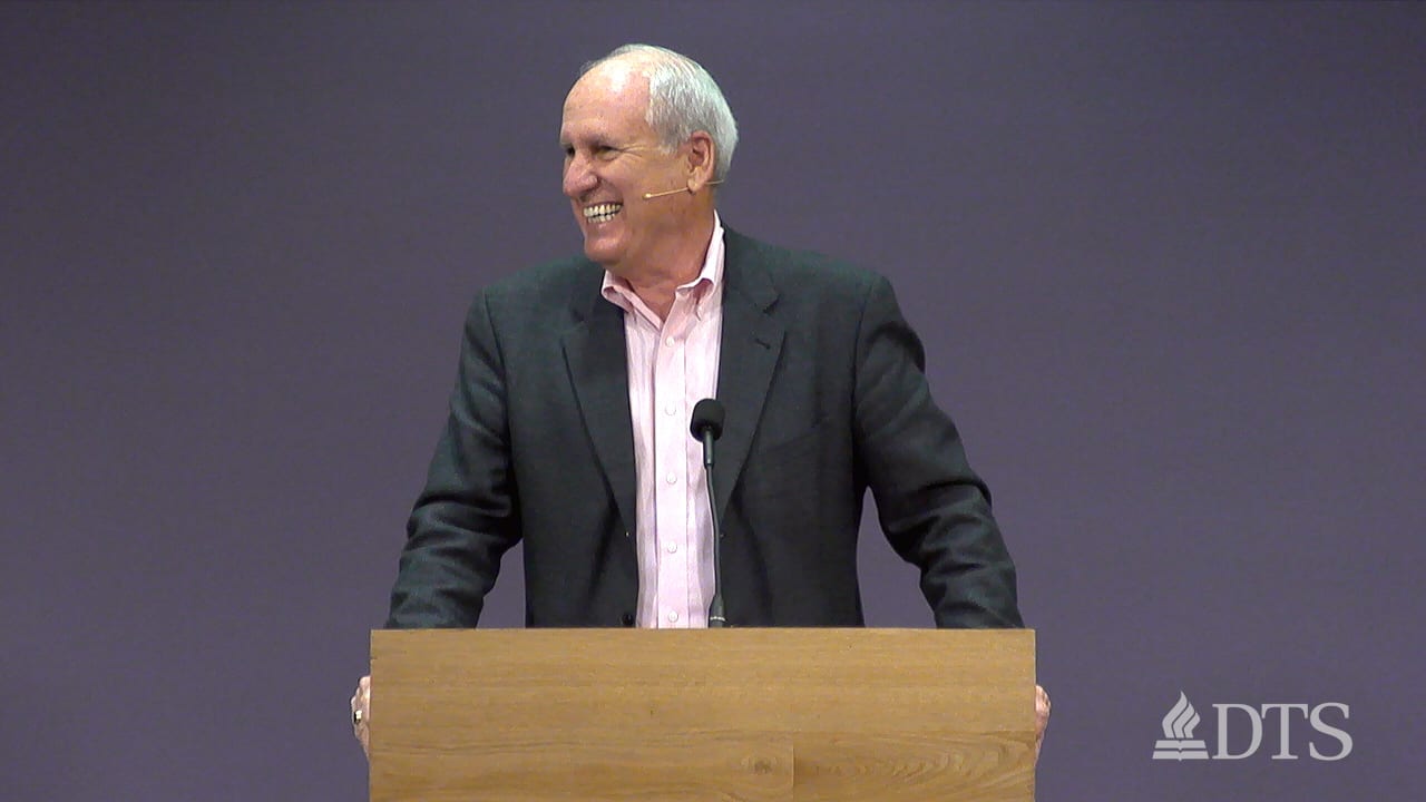 man standing at podium speaking at DTS Chapel