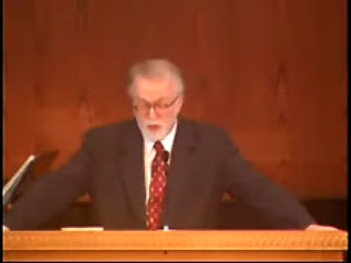 man standing at podium speaking at DTS Chapel