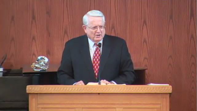 Dr. Chuck Swindoll standing at podium speaking at DTS Chapel